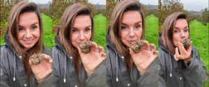 Woman enjoying the aroma of a freshly found white truffle during Alba Barolo truffle hunting